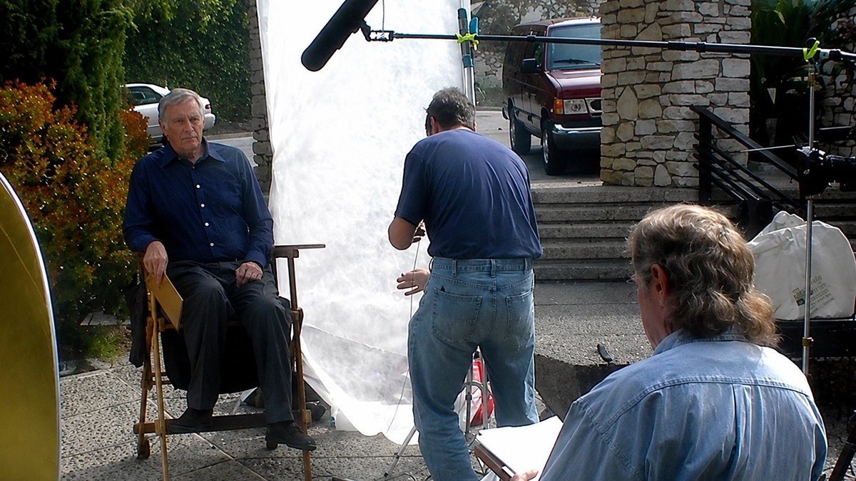 John Mulholland with actor Charlton Heston